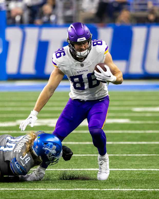 Jan 7, 2024; Detroit, Michigan, USA; Detroit Lions linebacker Alex Anzalone (34) dives and tackles Minnesota Vikings tight end Johnny Mundt (86) during second half at Ford Field.